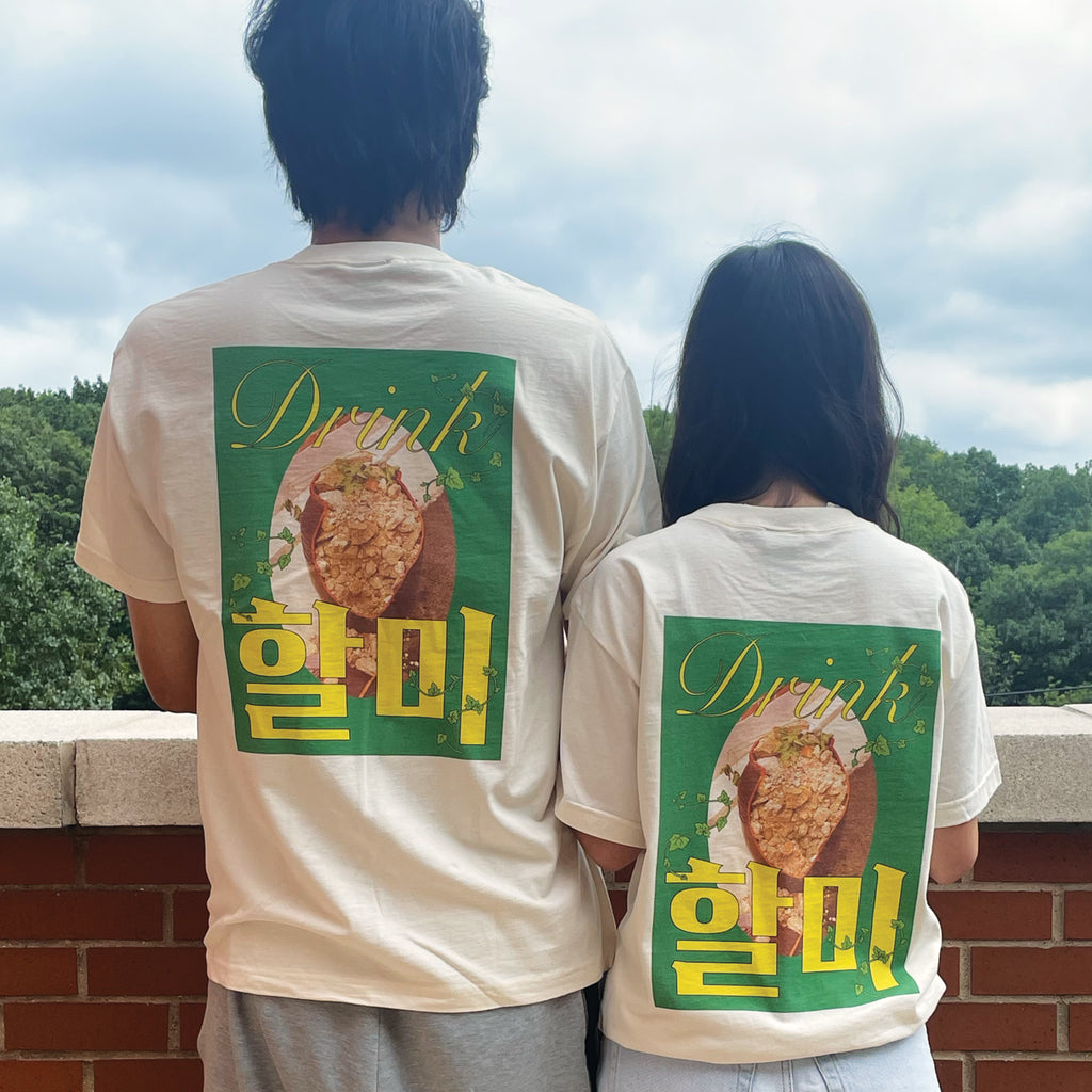 A couple wearing off-white Drink Halmi t-shirts