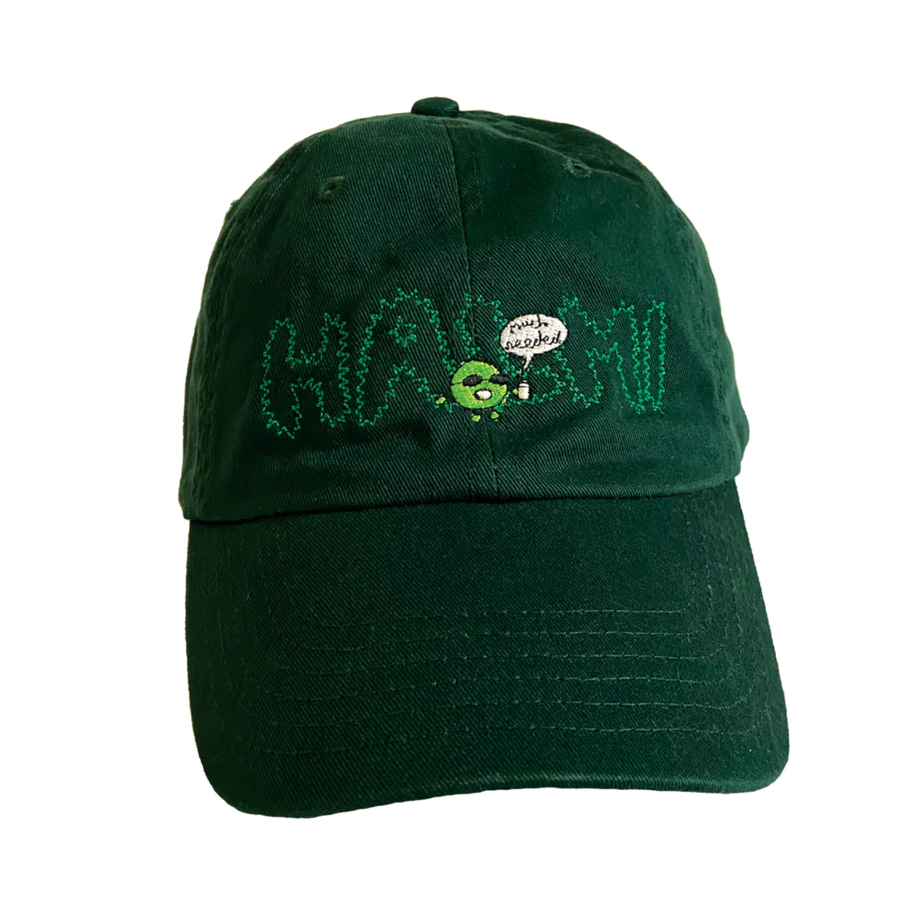 A forest green Halmi cap with embroidered HALMI and green blob saying much needed